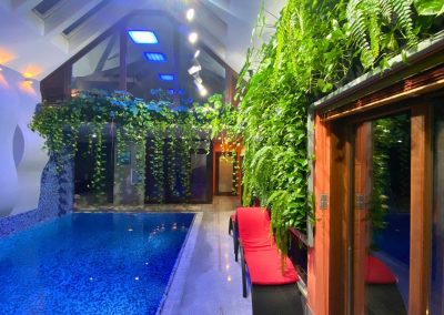 Vertical garden covering the interior with a pool